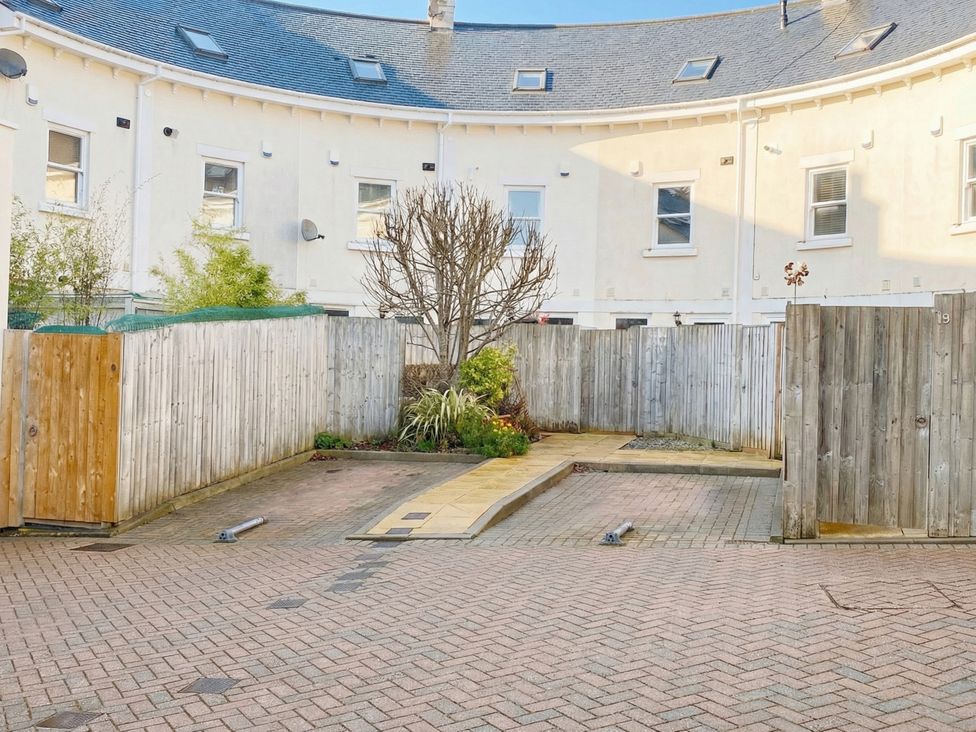 A garden area with a tree and pathway at Lisburne Place Torquay