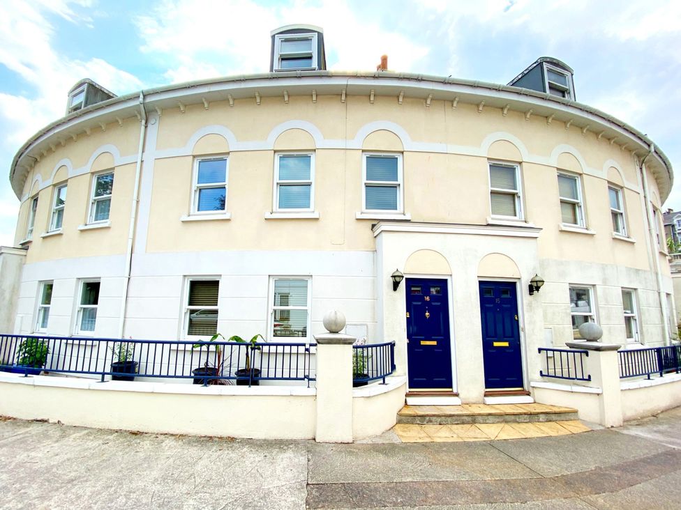 A building with round design and blue doors at Lisburne Place in Torquay