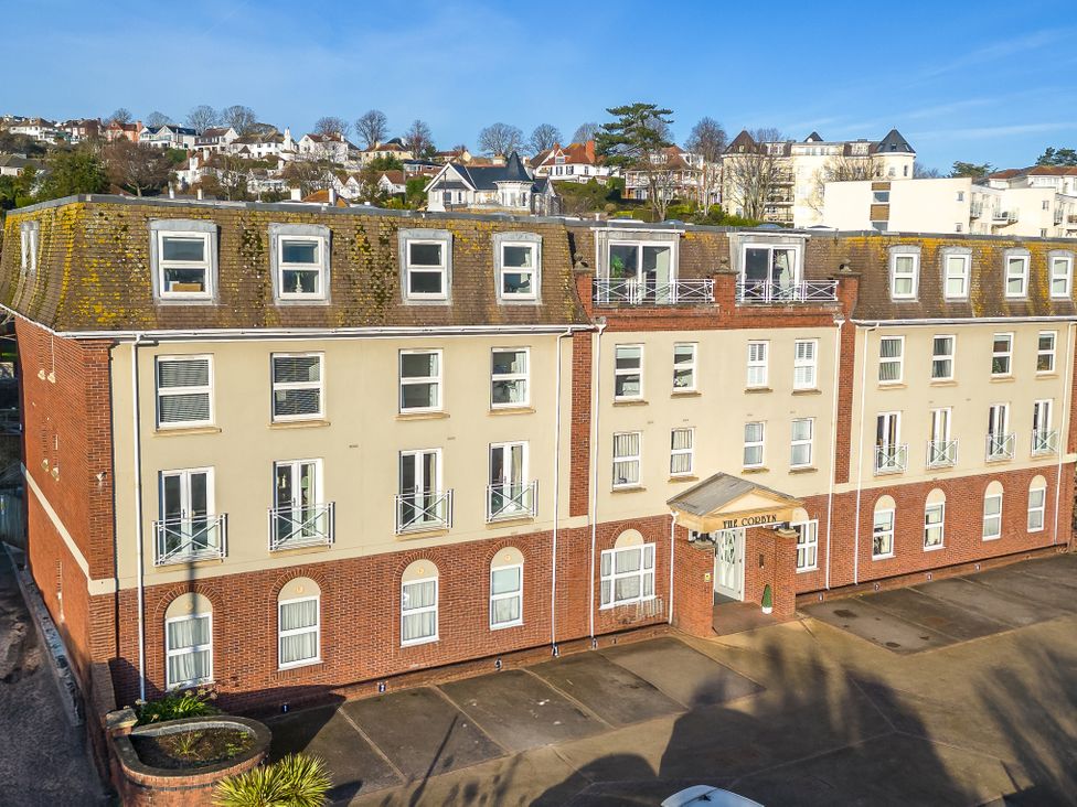 An apartment building with balconies and entrance at The Cordyn in Torquay
