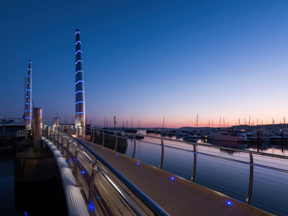 A marina with docks and boats at The Renoir Sea View Suite in Torquay