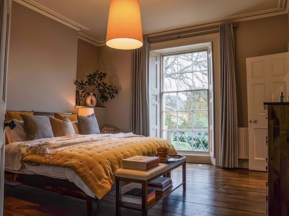 A bedroom with a bed and lamp at St Anne's Manor in Torquay