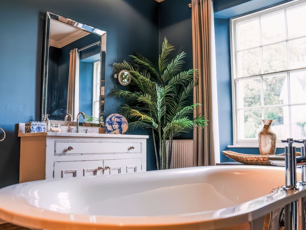 A bathroom with a sink and bathtub at St Anne's Manor in Torquay