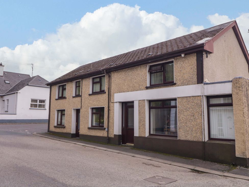 A house exterior with multiple windows and a door at 4 Bed Property in Northern Ireland, Garrison, County Fermanagh