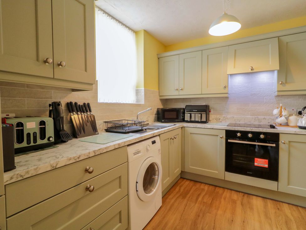 A kitchen with appliances and storage at 4 Bed Property in Northern Ireland, Garrison, County Fermanagh