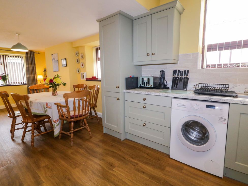 A kitchen with a table and chairs at 4 Bed Property in Northern Ireland Garrison, County Fermanagh