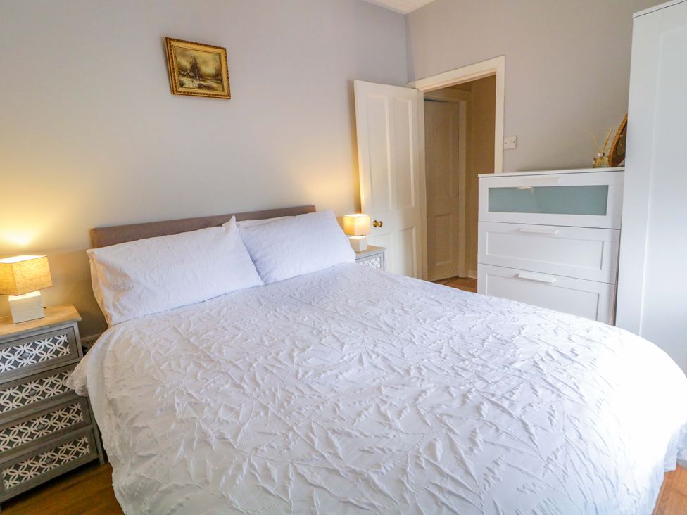 A bedroom with a bed and nightstand at 4 Bed Property in Northern Ireland Garrison, County Fermanagh