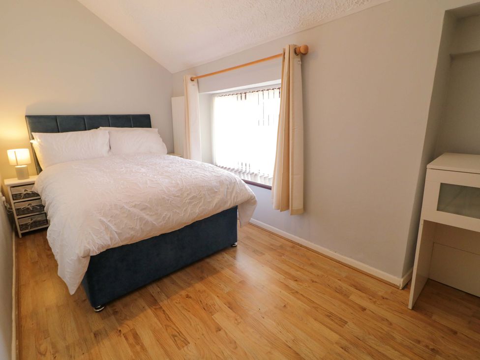 A bedroom with a bed and nightstand at 4 Bed Property in Northern Ireland Garrison, County Fermanagh