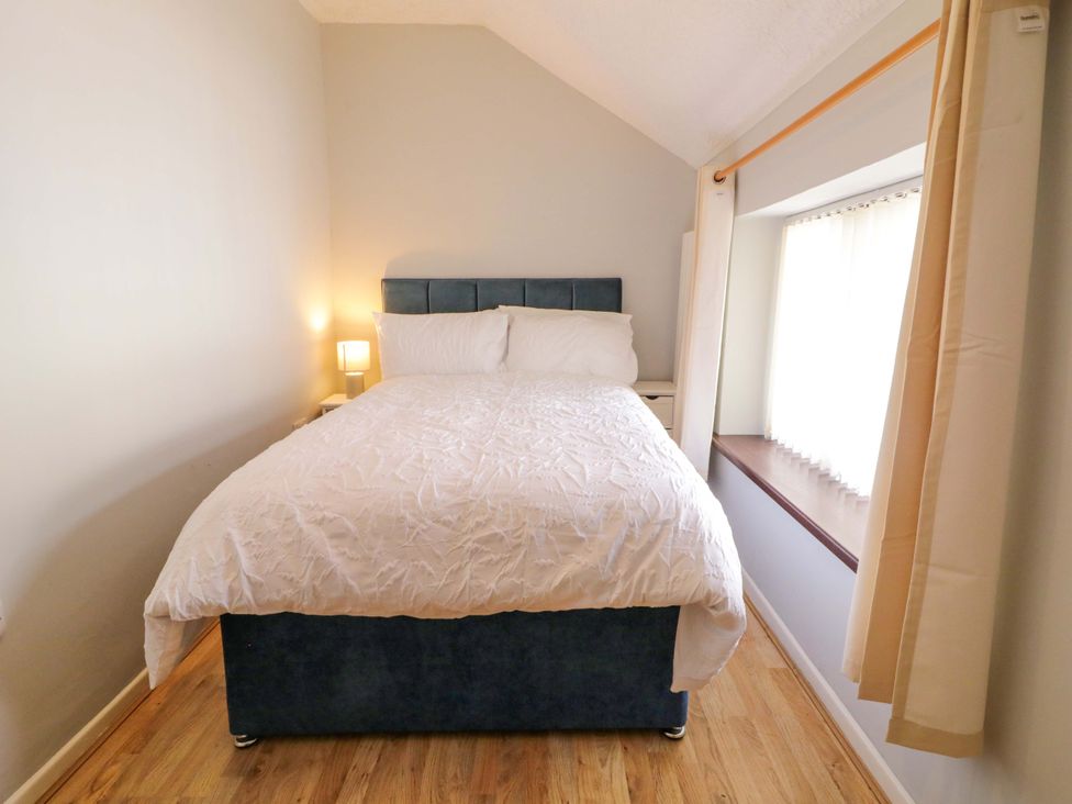 A bedroom with a bed and lamp at 4 Bed Property in Northern Ireland, Garrison, County Fermanagh