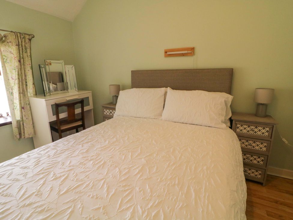 A bedroom with a bed and a dresser at 4 Bed Property in Northern Ireland, Garrison, County Fermanagh