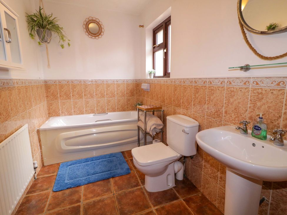 A bathroom with a bathtub, sink, and toilet at 4 Bed Property in Northern Ireland Garrison, County Fermanagh