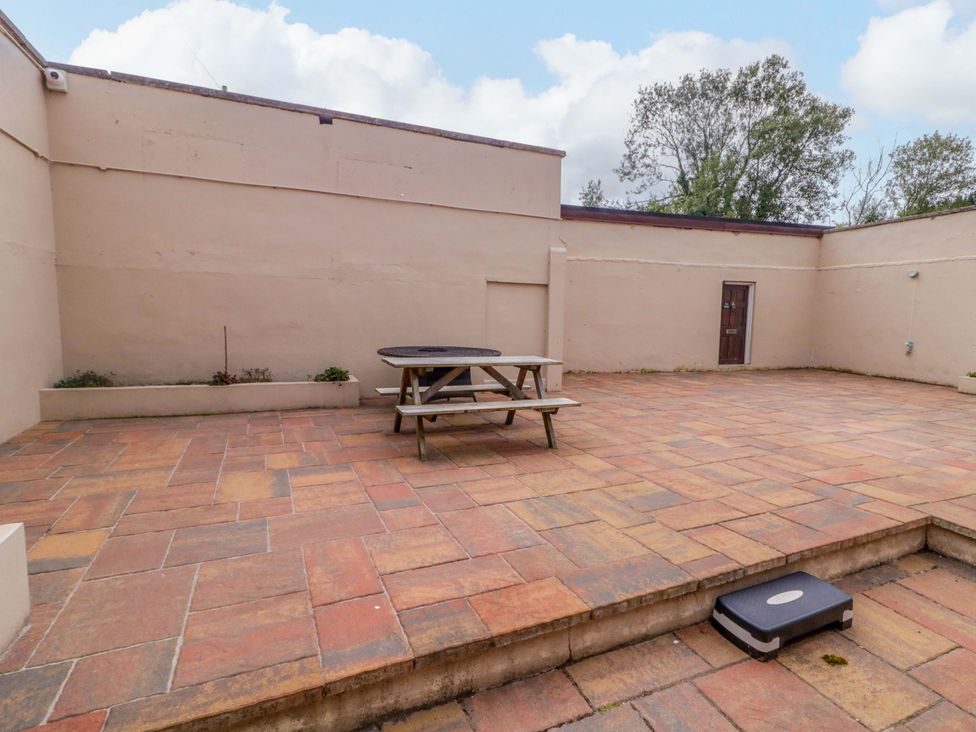 An outdoor area with a picnic table and plants at 4 Bed Property in Northern Ireland Garrison, County Fermanagh