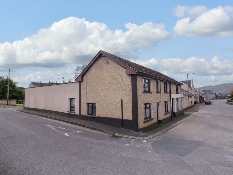 An exterior view of a building on a street at 4 Bed Property in Northern Ireland, Garrison, County Fermanagh