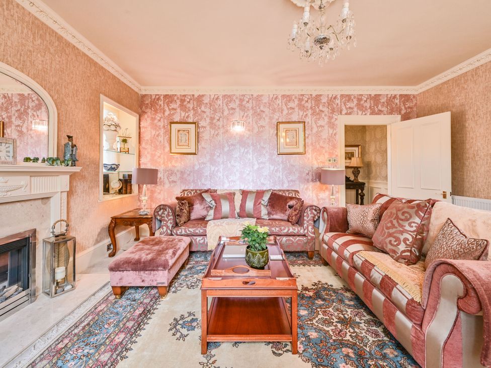 A living room with sofas and a coffee table at Muntham Luxury Town House with Hot Tub Torquay