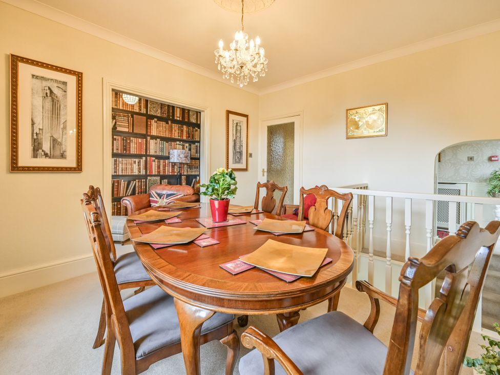 A dining room with a table and chairs at Muntham Luxury Town House with Hot Tub, Torquay