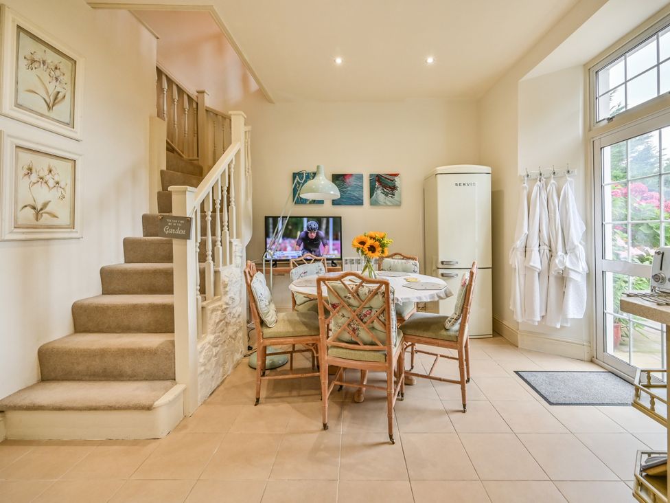 A dining room with a table and chairs at Muntham Luxury Town House with Hot Tub in Torquay
