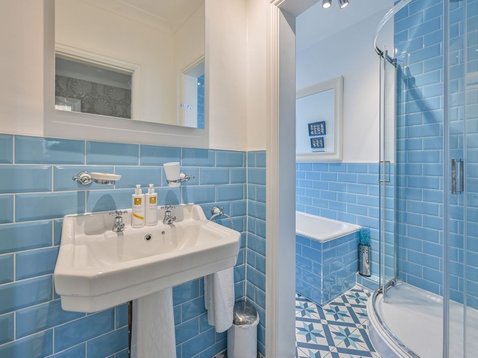A bathroom with a sink, shower and bathtub at Muntham Luxury Town House with Hot Tub, Torquay