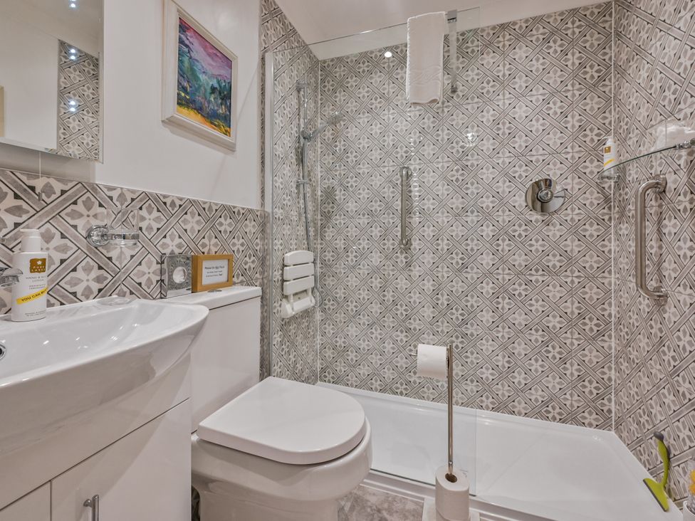 A bathroom with shower and sink at Muntham Deluxe Apartment 2 Torquay