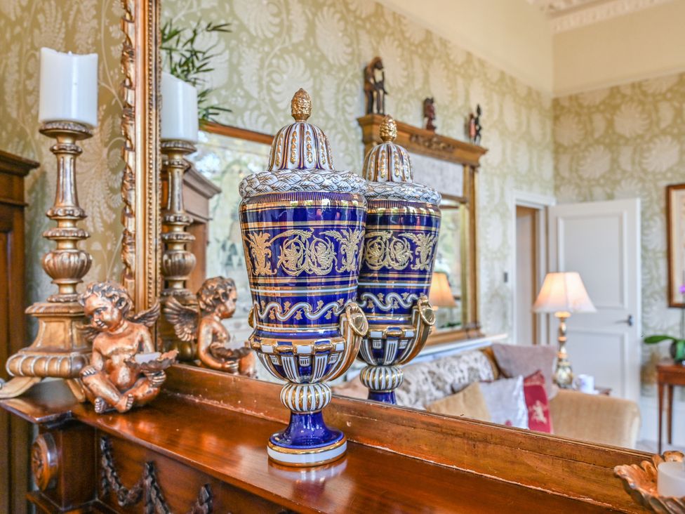 Two decorative vases on the mantle in the living room at Muntham Deluxe Apartment 3, Torquay