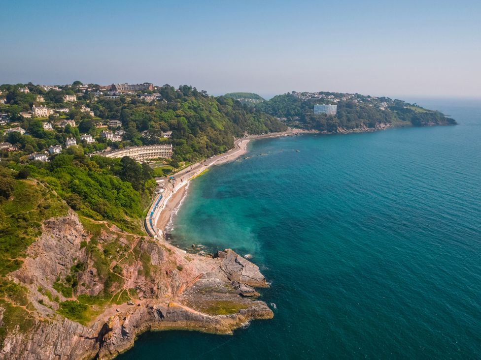 An aerial view of a beach and cliffs at Muntham Deluxe Apartment 3 in Torquay
