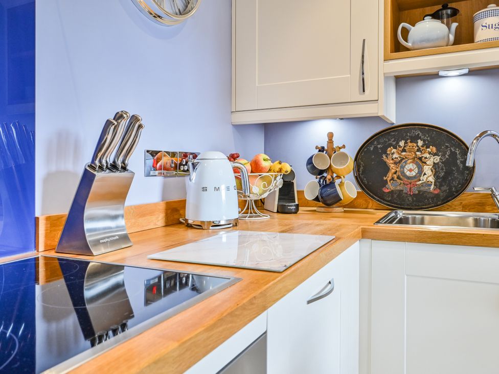 A kitchen with a knife block and kettle at Muntham Apartment 4 in Torquay