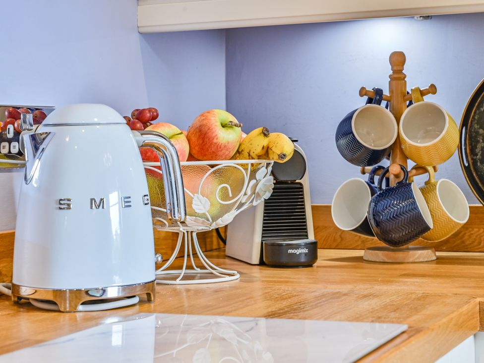 A kitchen with a kettle and coffee machine at Muntham Apartment 4 in Torquay