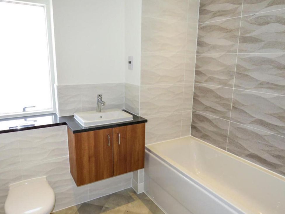 A bathroom with a sink and bathtub at the property