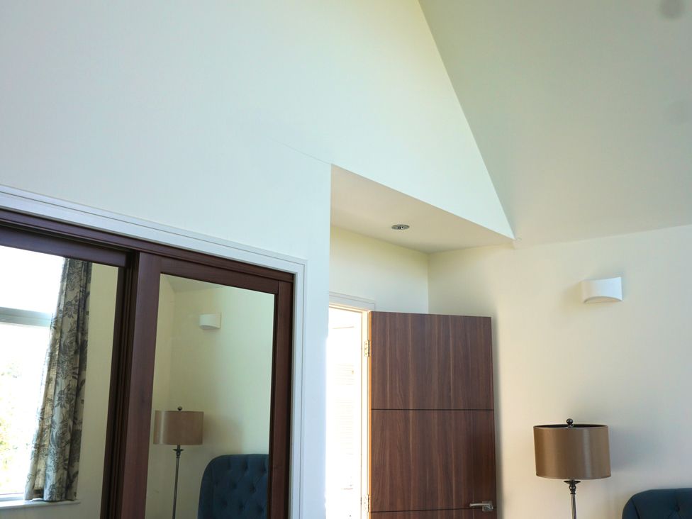 A room with a window and a door at 