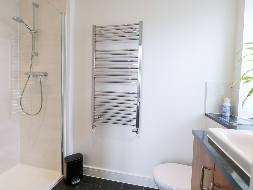 A bathroom with a shower and toilet at Manor Park View in Norwich