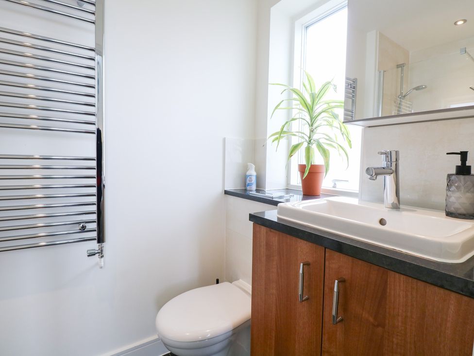 A bathroom with a sink and toilet at Manor Park View in Norwich