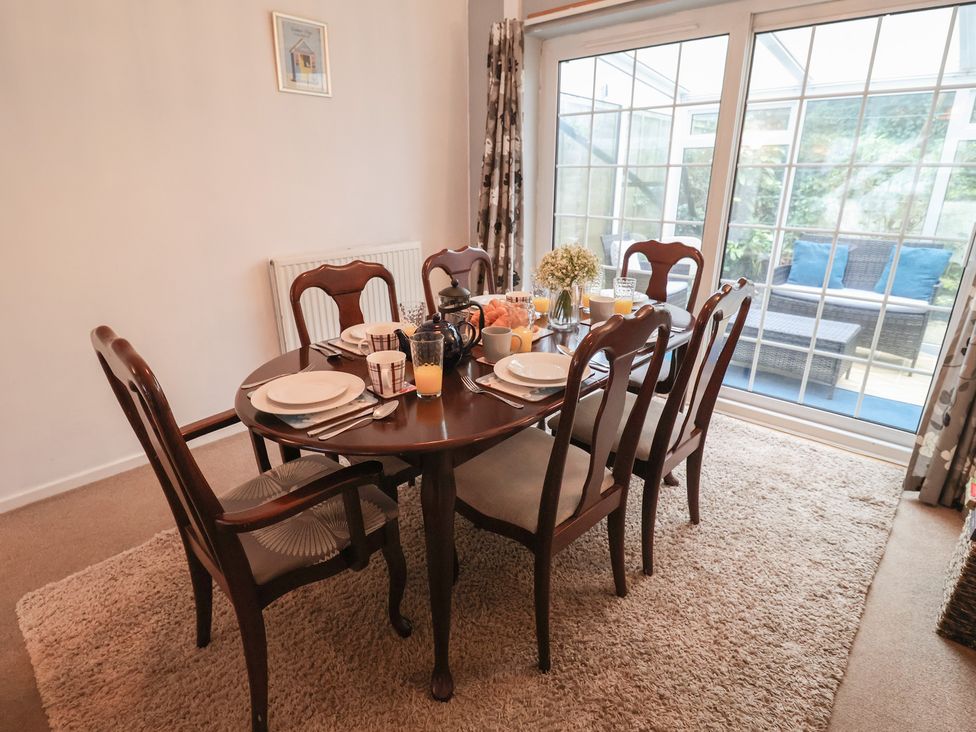 A dining room with a table set for breakfast at Cromer Holiday Home in Cromer