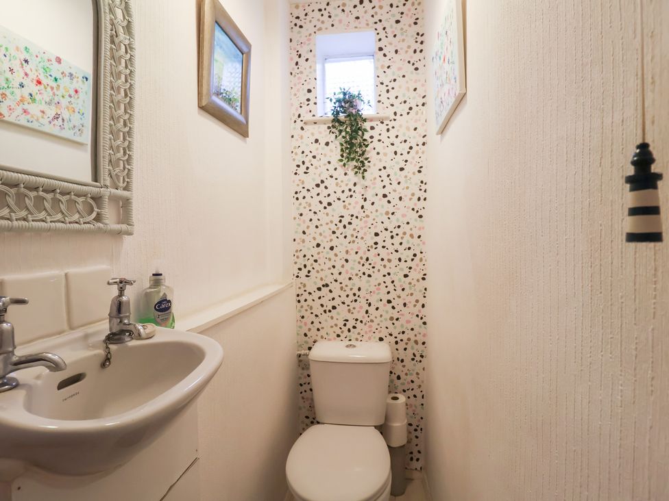 A bathroom with a sink and toilet at Cromer Holiday Home Cromer