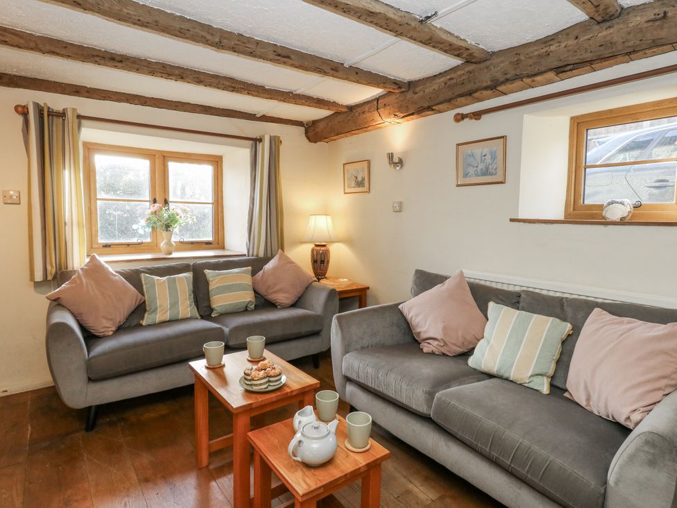 A living room with two sofas and a coffee table at Honeysuckle Cottage Smallridge Nr. Axminster