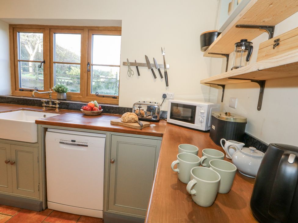 A kitchen with a sink and countertop appliances at Honeysuckle Cottage Smallridge Nr. Axminster