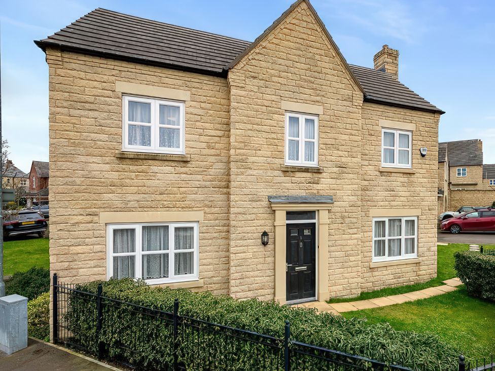 An exterior view of a house with windows and garden at The Winster in Marple, Stockport