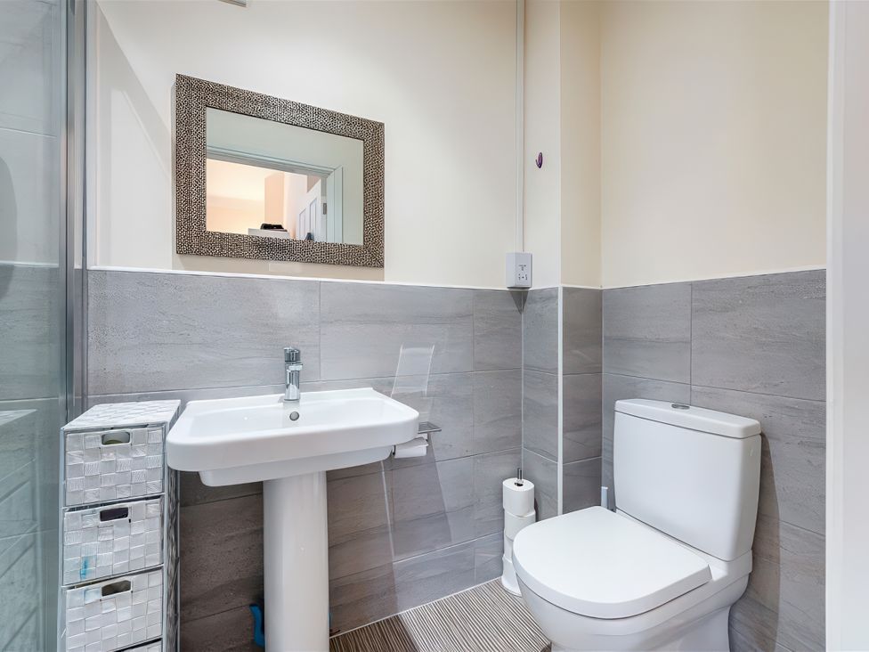A bathroom with a sink and toilet at The Winster in Marple, Stockport