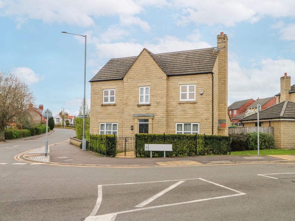 A house with a garden and pathway at The Winster in Marple, Stockport