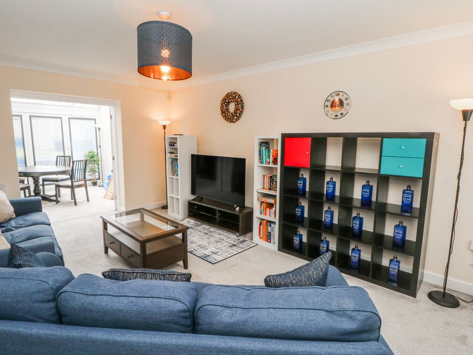 A living room with a sofa and coffee table at The Winster in Marple, Stockport