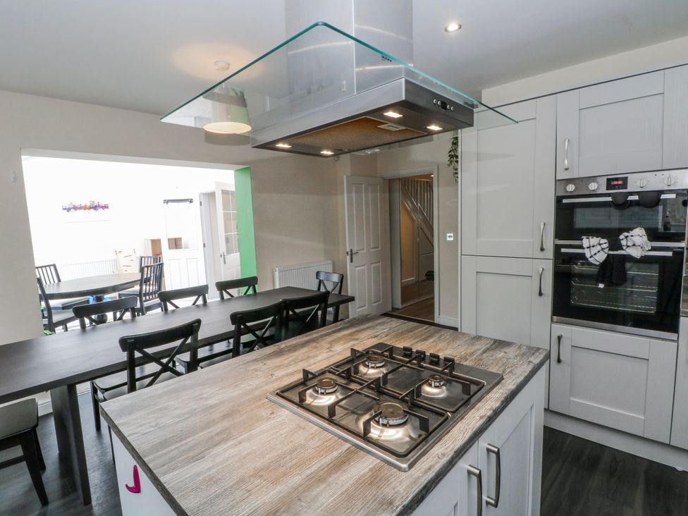 A kitchen with a gas hob and oven at The Winster in Marple, Stockport