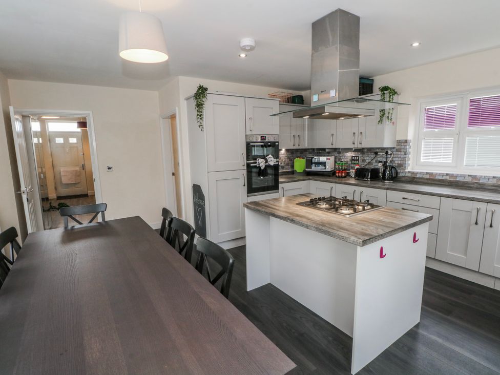 A kitchen with cabinets and an island at The Winster in Marple, Stockport