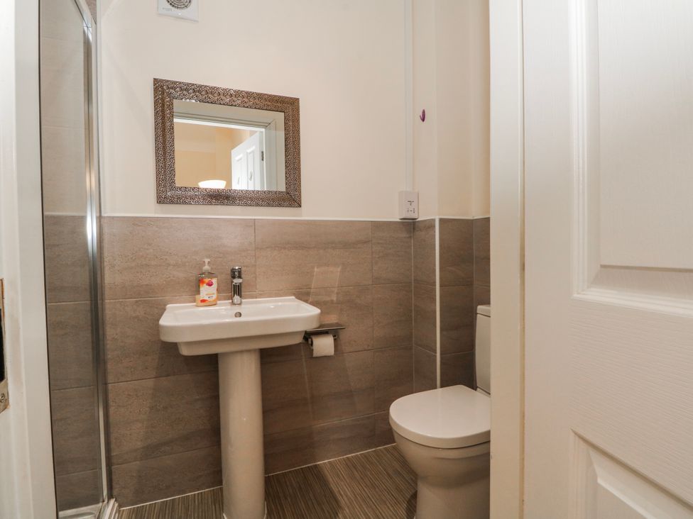 A bathroom with a sink and toilet at The Winster in Marple, Stockport