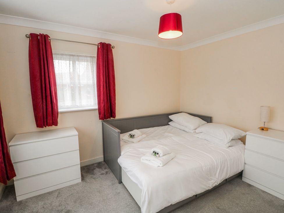 A bedroom with a bed and chest of drawers at The Winster in Marple, Stockport