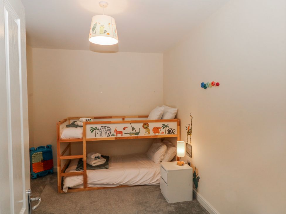 A bedroom with a bunk bed and nightstand at The Winster in Marple, Stockport