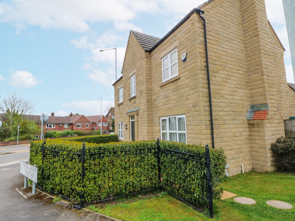 A house with windows and a fenced area at The Winster in Marple, Stockport