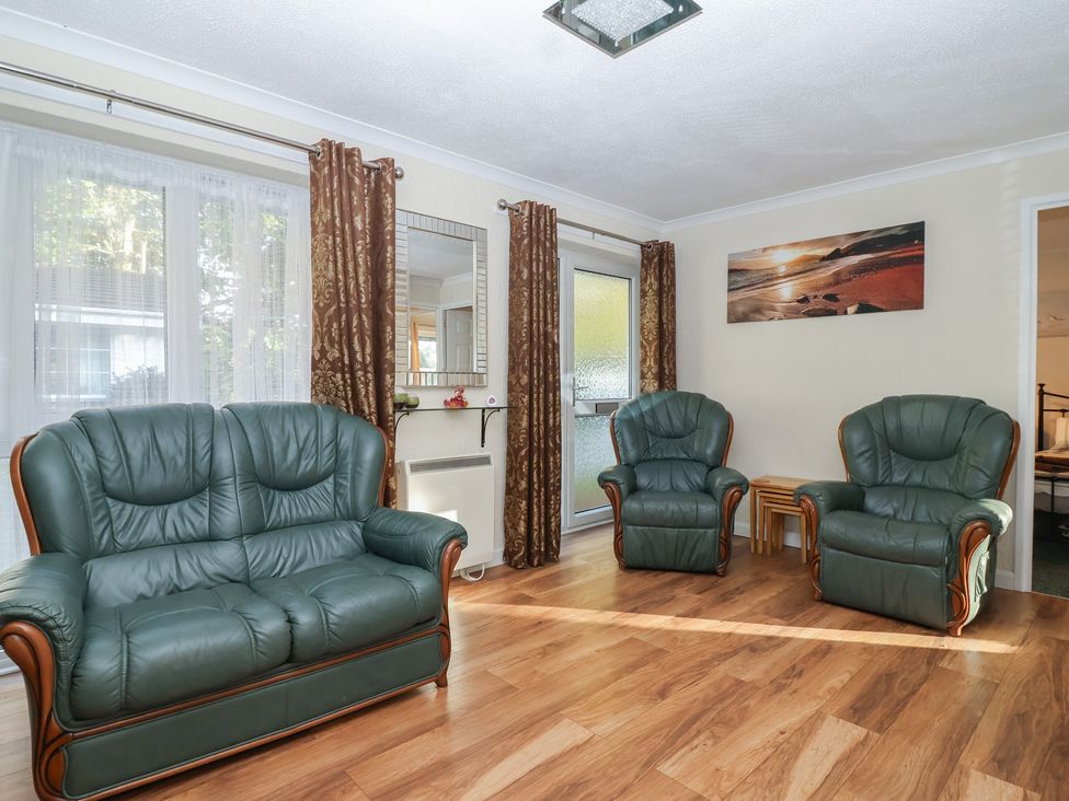 A living room with two armchairs and a sofa at Willow Lodge near Liskeard