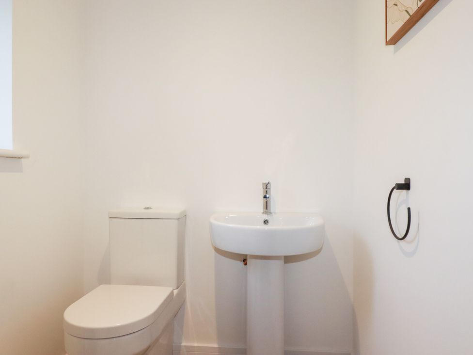 A bathroom with a toilet and sink at Barn 5