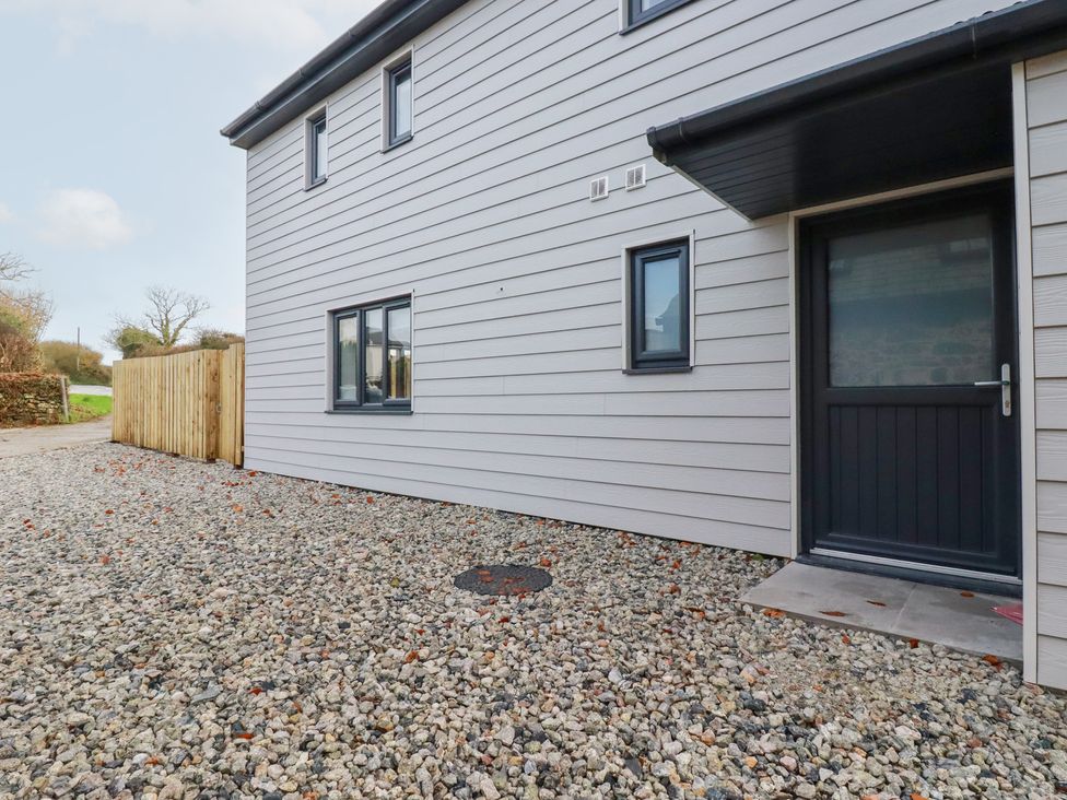An outdoor area with a building entrance at Barn 5