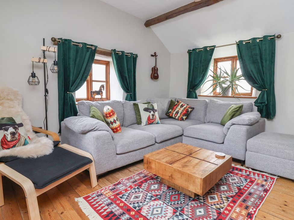 A living room with a sofa and coffee table at The Ranch in Prestatyn