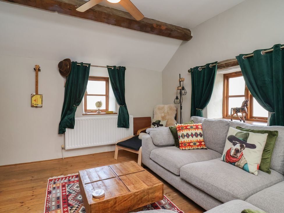 A living room with a sofa and a coffee table at The Ranch in Prestatyn