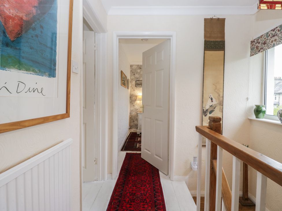 A hallway with a door and a rug at Apple Byrd in Kendal