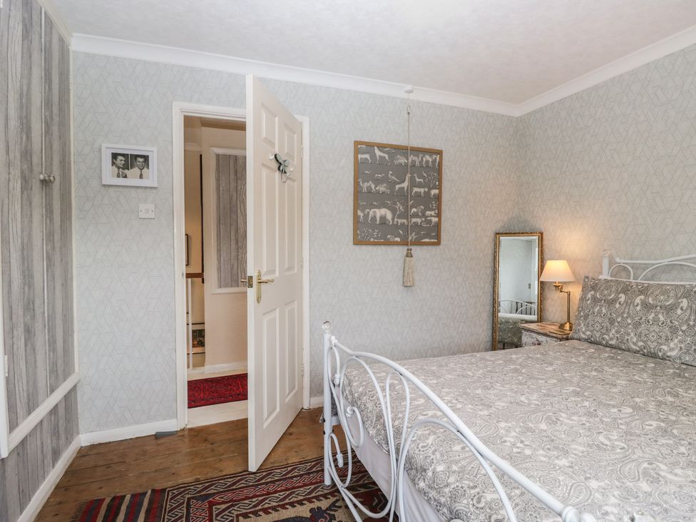A bedroom with a bed and lamp at Apple Byrd in Kendal